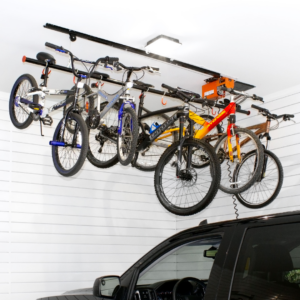 Bikes stored on a hoist inside a garage with Gridiron Cabinets